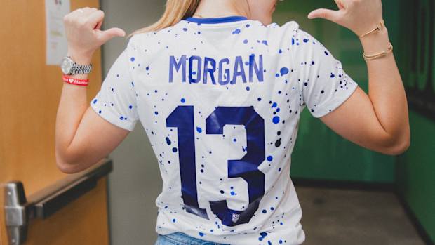 Sabrina Ionescu wears Alex Morgan's soccer jersey.